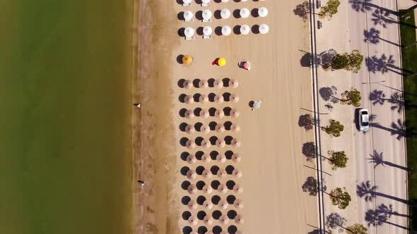 Concept of summer vacation. View from above, aerial view of an amazing beach with beach umbrellas