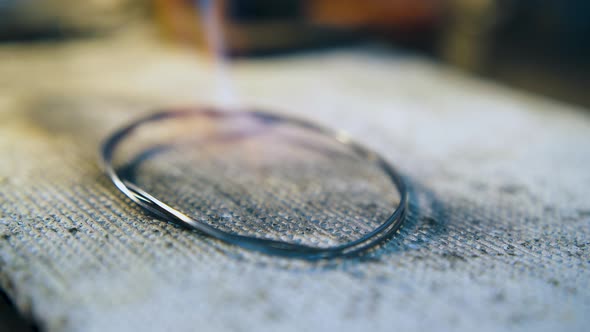 Heating Gold Rod with Gas Burner in Jewelry Shop Closeup alt