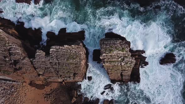 Aerial View of Reefs and Cliffs After Dawn on Arnia Beach. Northern Spain in Summer