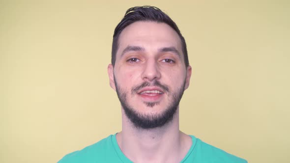 Portrait of Young Bearded Man Talking on Webcam alt