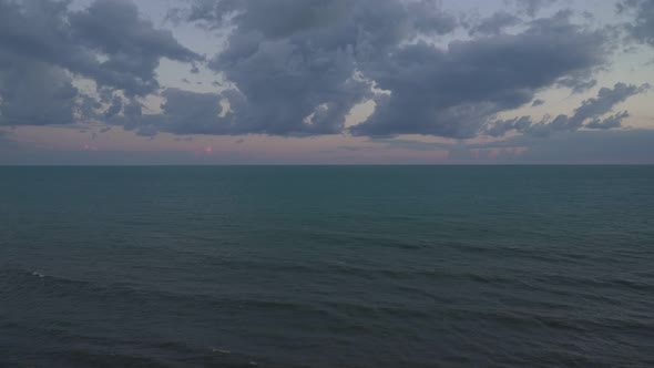 Evening Seascape Dark Sea and Gloomy Sky with Clouds alt