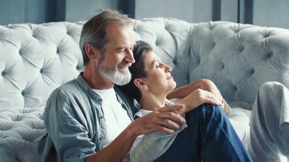 Elderly Couple Sitting Floor alt