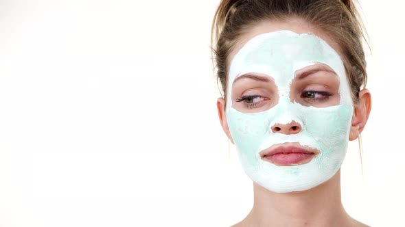 Girl with Green Mud Mask on Face