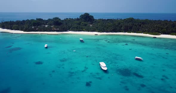 Natural fly over travel shot of a white paradise beach and aqua turquoise water background alt