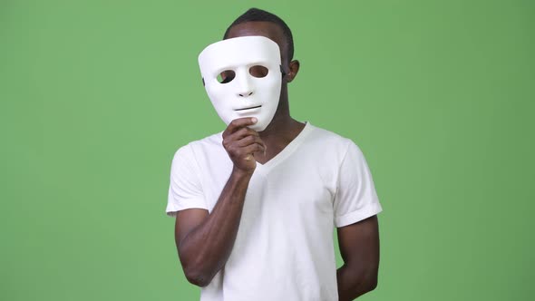 Young African Man with White Mask alt