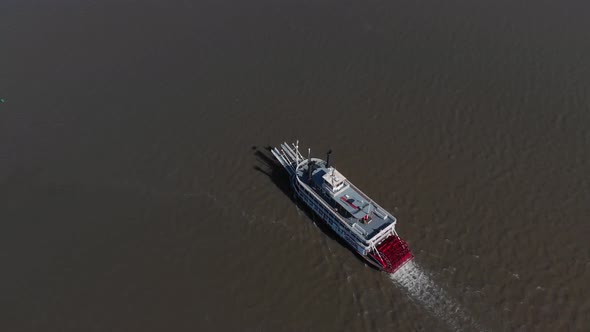 Aerial view of a paddlewheel riverboat on the mighty Illinois River.  Old fashioned technology works alt