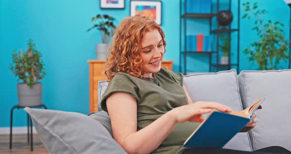 A Momtobe Relaxes on the Couch During Her Maternity Leave alt