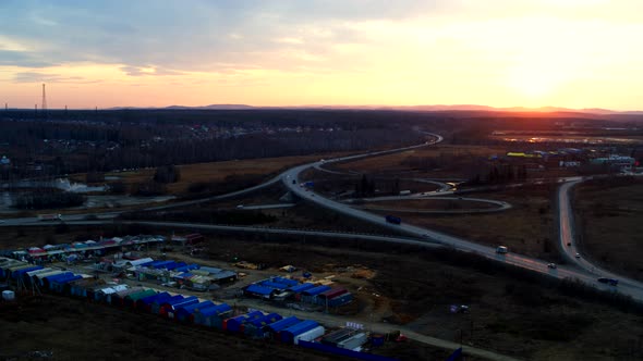 Huge Road Junction Full of Cars and Trucks in Countryside in Winter, Aerial View alt
