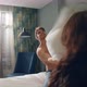 Hot Couple Joking on Luxury Hotel Bed. Fancy Couple Having Pillow Battle Indoors