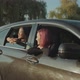 Diverse Women Admire View From Car Window at Sunset - VideoHive Item for Sale