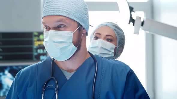 Professional medical doctors working in emergency medicine. Portrait of surgeon and the nurse. alt