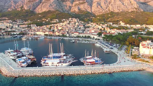 Aerial view of dalmatian harbour with houses and football stadium alt