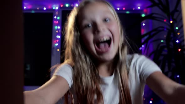 Happy Baby Girl Opens the Box and Enjoys the Holiday Gift. Close-up, Inside View alt