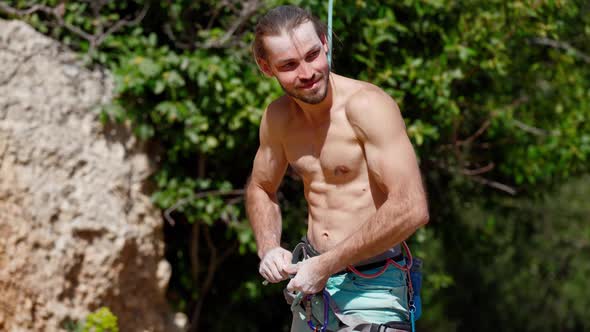 Athletic Man Confident After Rock Climbing Cliff Proud of His Achievement alt
