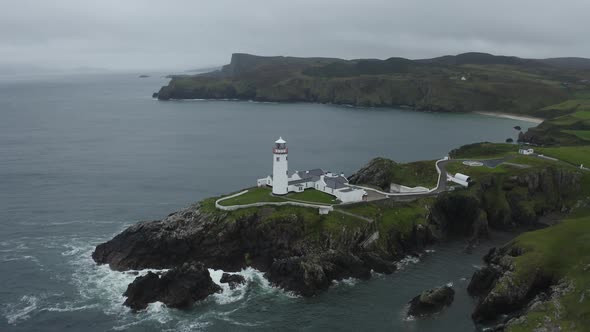 Aerial drone establishing shot of Fanad Head Lighthouse in Northern Ireland alt