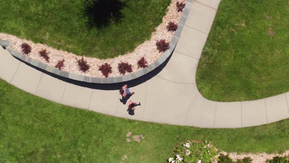 Overhead view of couple running at park