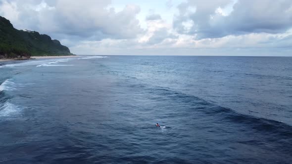 Surfer catch the wave Beautiful fluffy clouds alt