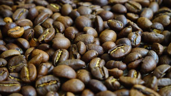 Rotating background from coffee beans. alt