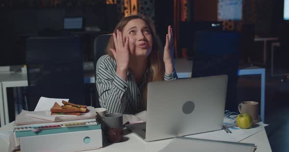 Stressed Young Woman Looking Sad Because of Problem While Using Laptop, Depressed Girl Employee alt