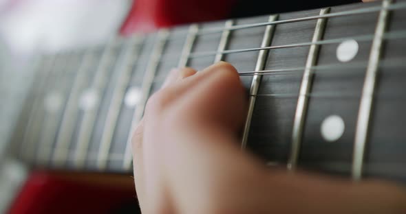 Playing the Guitar Strumming Acoustic Guitar Man Hand with a Guitar Neck