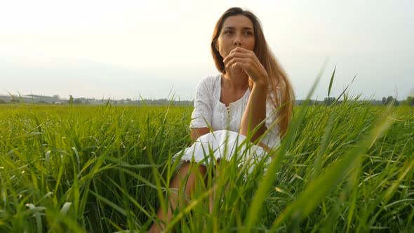 Beautiful Young Woman Enjoying Nature in Summer Evening. Portrait Happy Young Woman alt