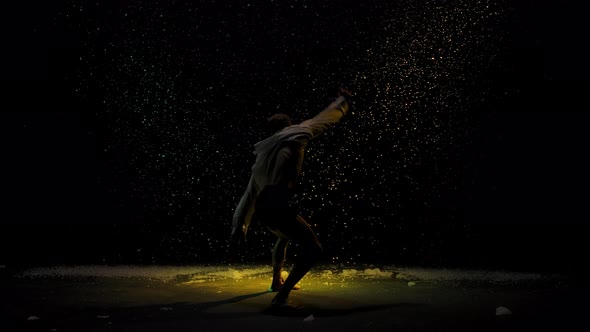 Emotional Performance of Contemporary Choreography or Modern Ballet. A Silhouette of a Man Against alt