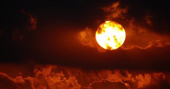 Great sunset through clouds alt