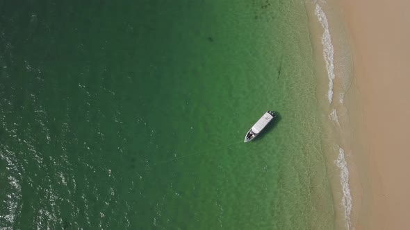 Aerial Top View on the Beach with a Boat