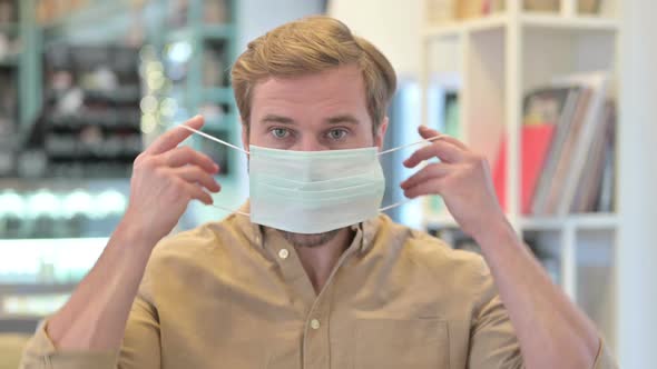 Close Up of Young Man Wearing Face Mask alt