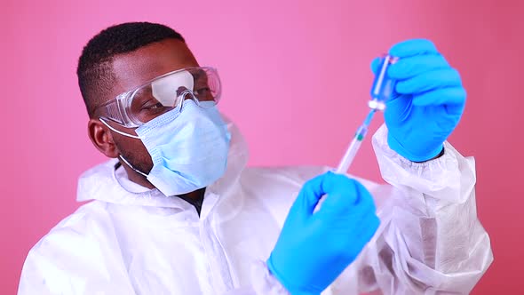 Corona Virus SARSCoV2 Vaccination Concept  Man in Pink Studio Wall Background alt