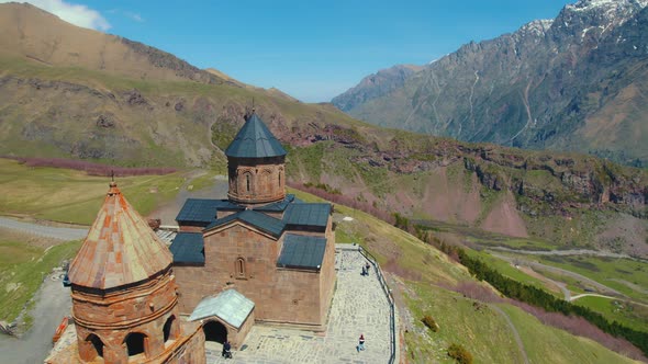 Ascending View of Ancient Gergeti Holy Trinity Church in Kazbegi Georgia alt