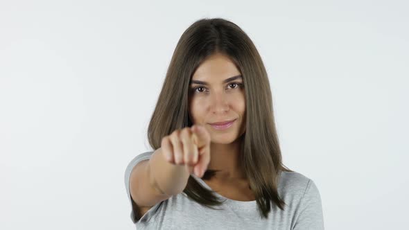 Pointing Finger of Girl toward Camera, White Background in Studio alt
