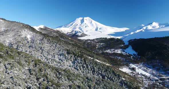 Drone Birds Eye View Of Lonquimay Volcano And Corralco Ski Resort In Chile Andes Mountains alt