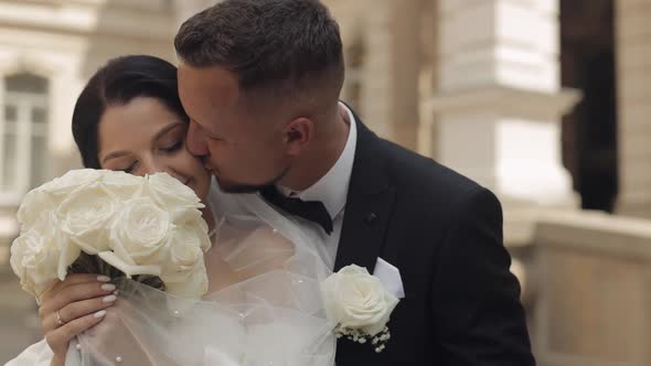 Newlyweds Portrait Caucasian Groom Bride Walking Embracing Hugs Near Old Castle Wedding Couple alt