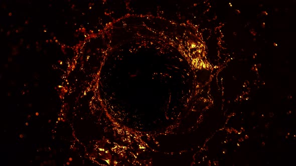 Super Slow Motion Shot of Golden Liquid Whirl Isolated on Black Background at 1000Fps. alt