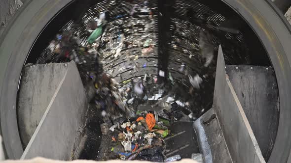 Solid Waste Sorting Drum Machine Inside Trash Recycling Facility alt