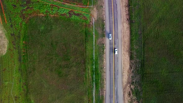 Cars pass each other on the Cabrillo Highway in California at sunrise alt