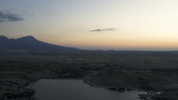 Drone Flies Forward Very Close to Lake Surface