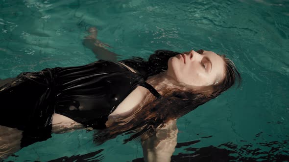 The Woman Swims in the Pool alt