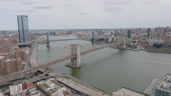 Aerial Panoramic Shot of Rush Hour on Roads Around Bridges Over East River alt