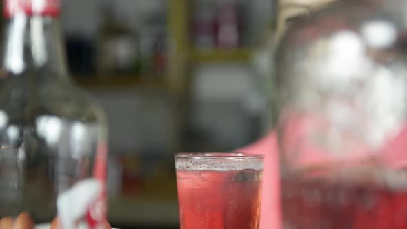 Bartender squeezing lemon alt