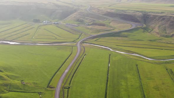 Green fields and ring road in Iceland seen from above alt