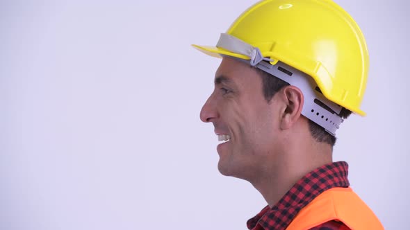 Closeup Profile View of Young Happy Hispanic Man Construction Worker Smiling