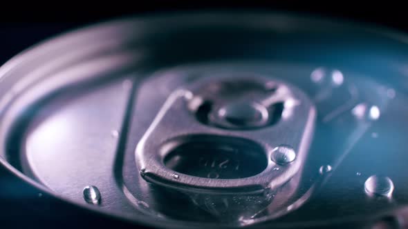 Jar with Soda and Water Drops in Close-up. Blue Light with Highlights alt