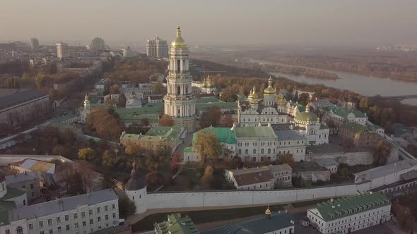 Aerial Kyiv Pechersk Lavra churches and monastery on hills of Dnipro river Ukraine alt