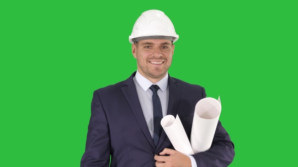 Smiling architect or engineer walking while keeping projects alt