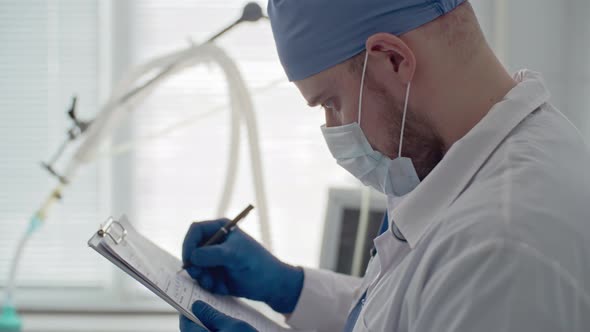 Doctor Writing Medical History alt