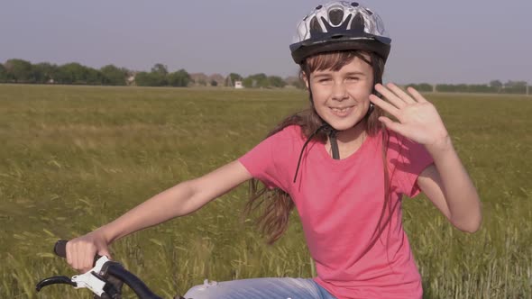 Wave hand on bike. alt