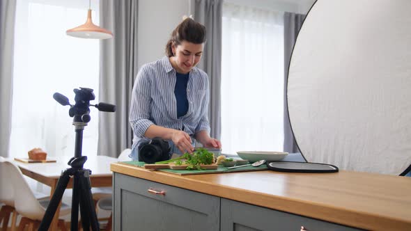Food Photographer with Camera Working in Kitchen