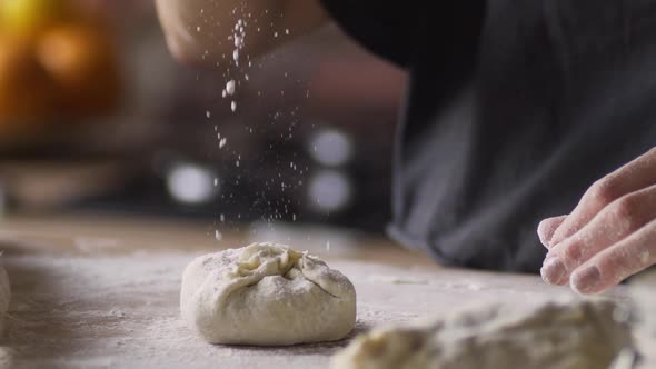 Cook Sprinkles Raw Homemade Cake with Flour Closeup